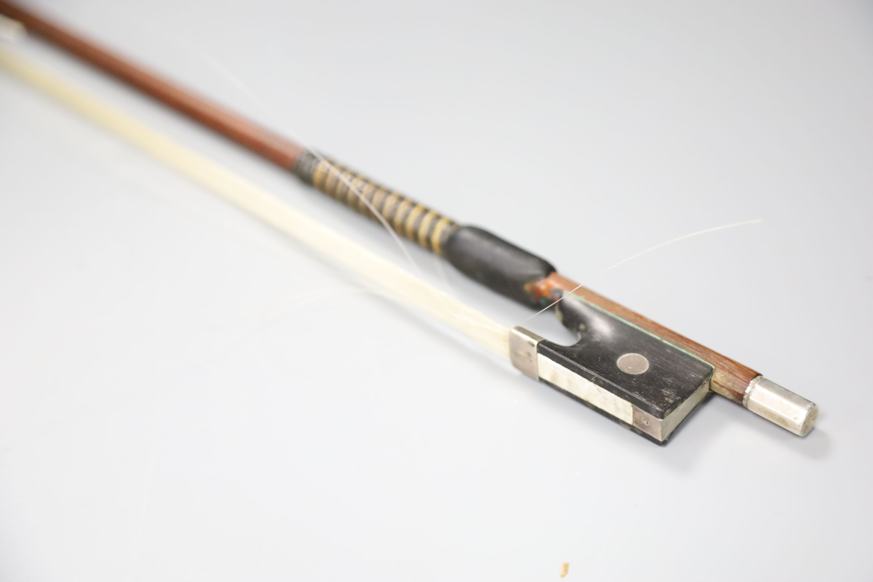 A 19th century German silver-mounted violin bow with original lapping